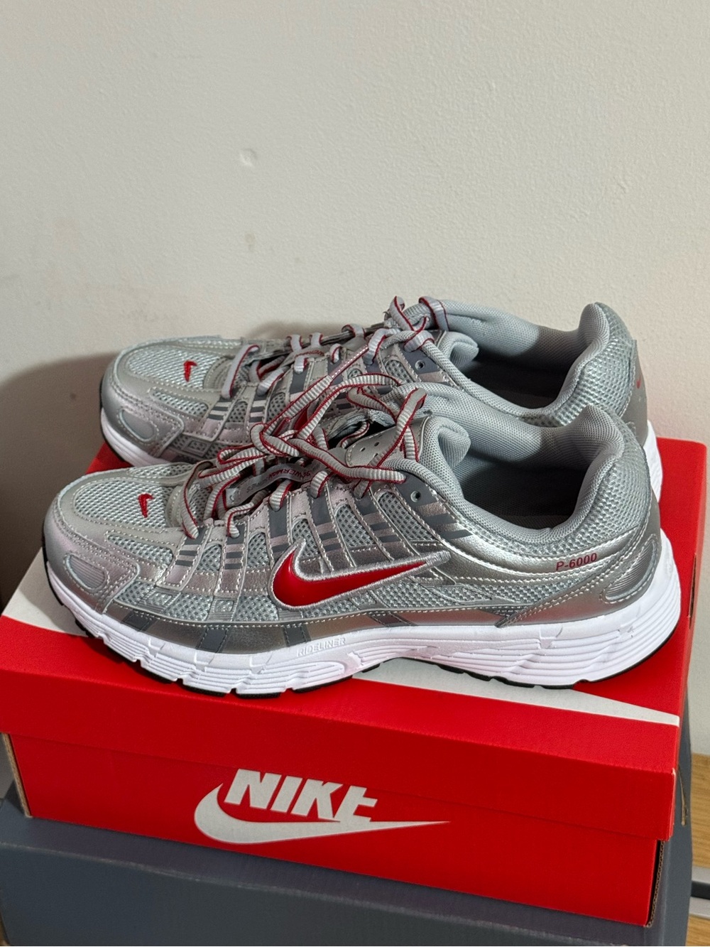 Size 6.5Y Nike P-6000 metallic Silver and Red Athletic Sneakers. Size EU 39